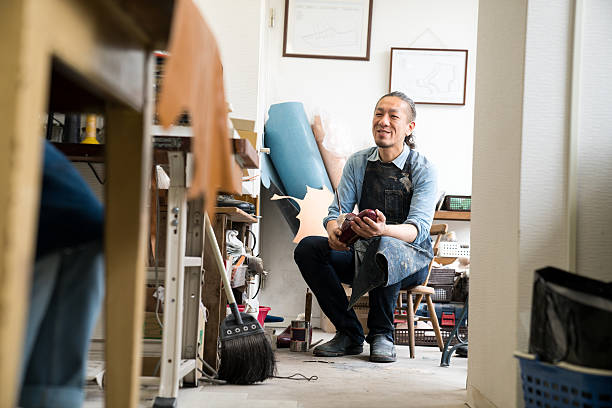 istock Entrepreneur shoemaker working in his small shoe shop 625150958