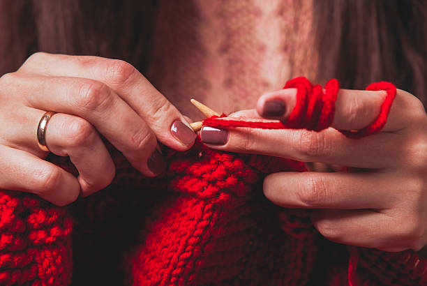 istock Female hands knits sweater 625157808