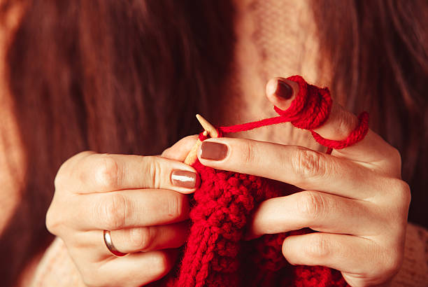 istock Female hands knits sweater 625157966