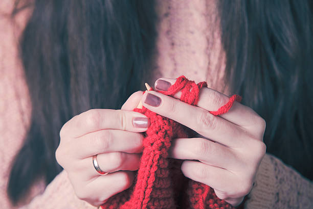 istock Female hands knits sweater 625158074