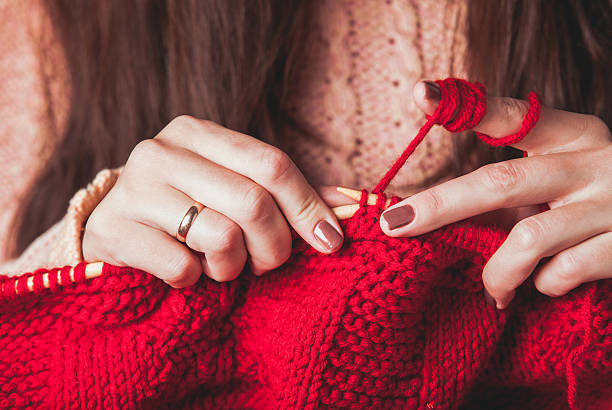 istock Female hands knits sweater 625158150