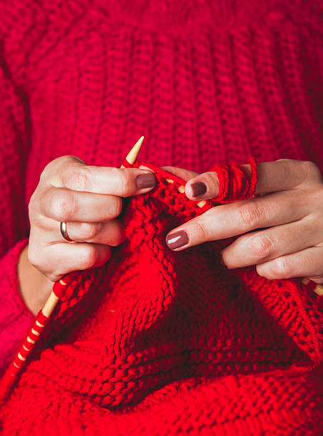 istock Female hands knits sweater 625158212