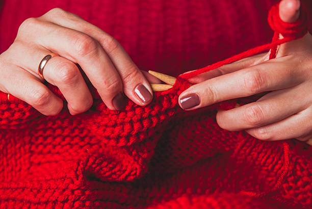 istock Female hands knits sweater 625158338