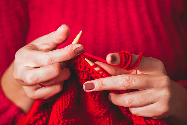 istock Female hands knits sweater 625158460