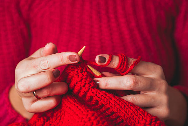 istock Female hands knits sweater 625158616