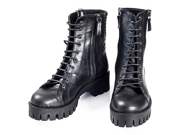 istock Black leather boots isolated on white background 625161974