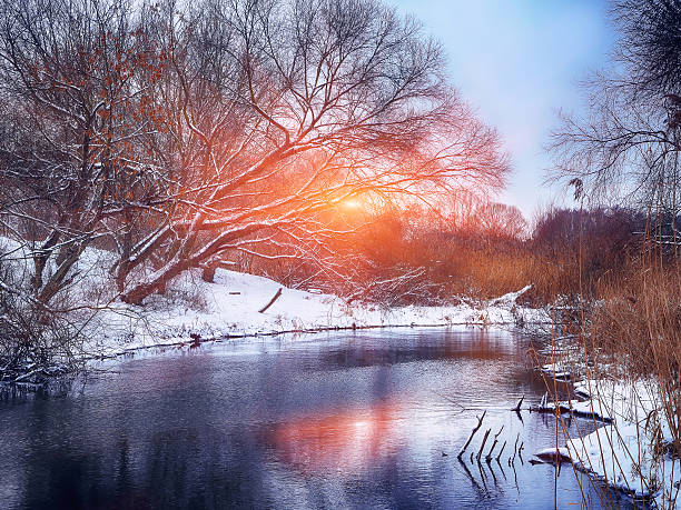 istock Winter landscape by a river in the sunset 625164688