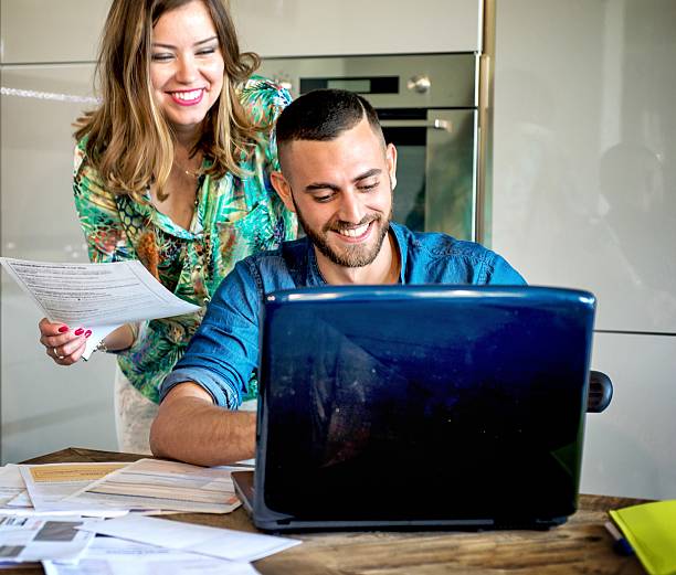 istock Smiling Couple in Front Laptop 625165470