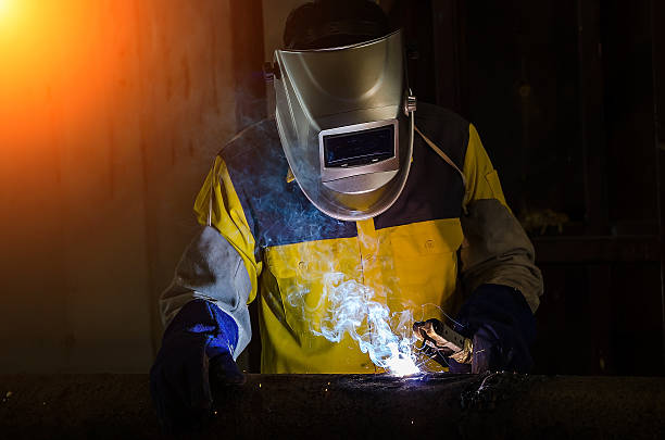 istock Industrial Worker at the factory welding closeup 625168074