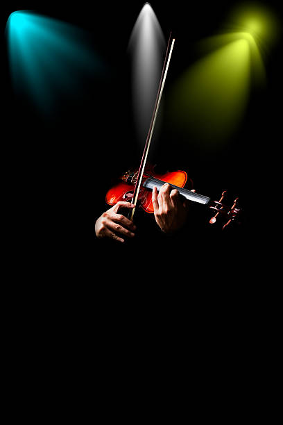istock male musician hands playing classical violin in concert 625188328