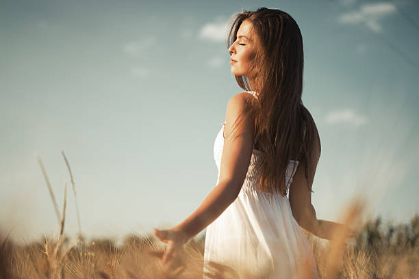 istock Beautiful carefree woman in fields 625192726