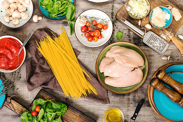 istock Raw Italian spaghetti with ingredients for preparing pasta 625192846