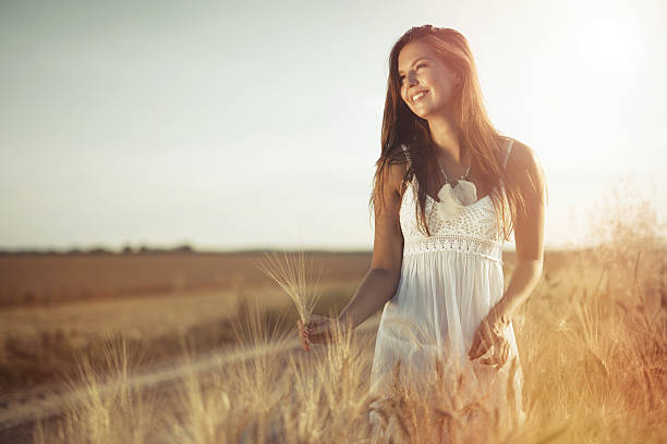 istock Beautiful carefree woman in fields 625193238
