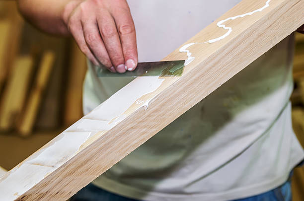istock Joinery work. Apply the adhesive on a wooden surface 625194768