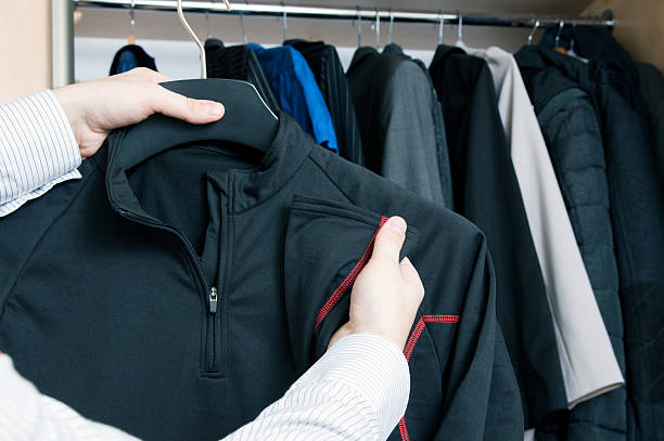 istock Man takes out thermoactive sweatshirt from the closet 625195494