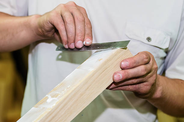 istock Apply the adhesive on a wooden surface 625195586