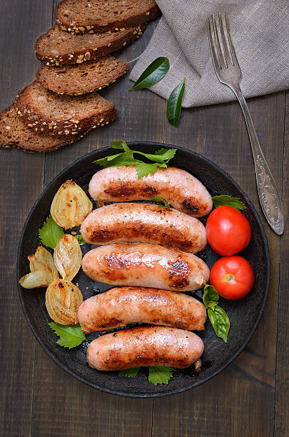 istock Barbecue sausages in frying pan 625202666