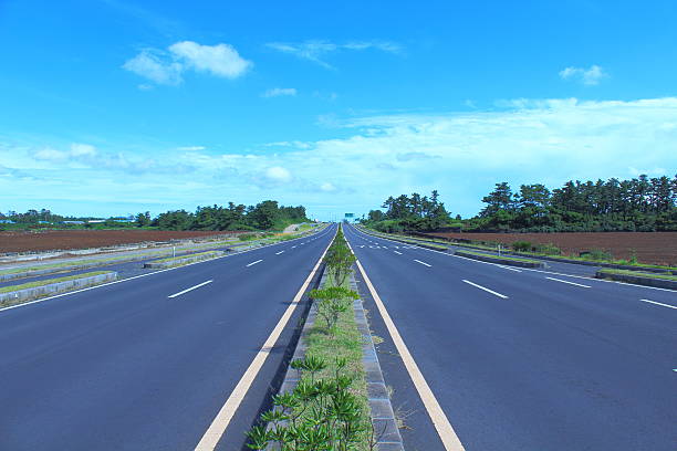istock car way in jeju island 625203780