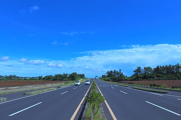 istock car way in jeju island 625205476