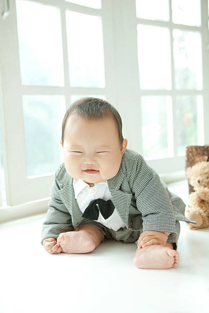 istock overweight suit tie baby 625209158