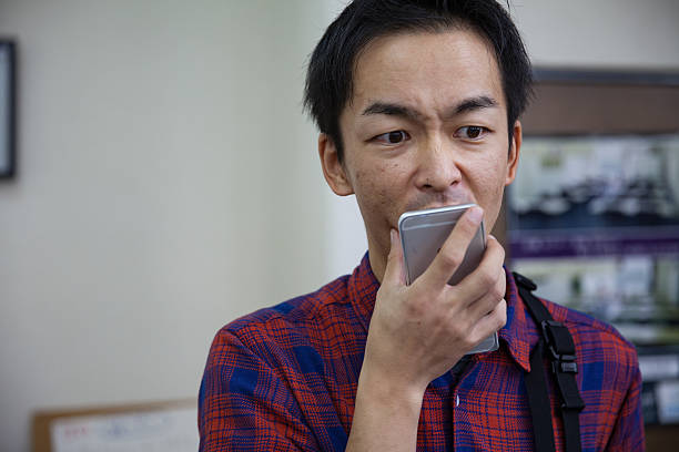 istock Japanese man talking on smart phone 625209614