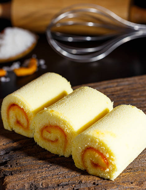 istock Yamroll orange on wood plate and black background 625218014
