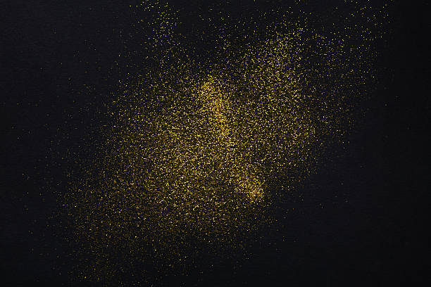 istock Golden glitter sand texture on black, abstract background. 625218996