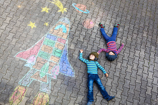 istock little kid boy flying by a space shuttle chalks picture 625219792