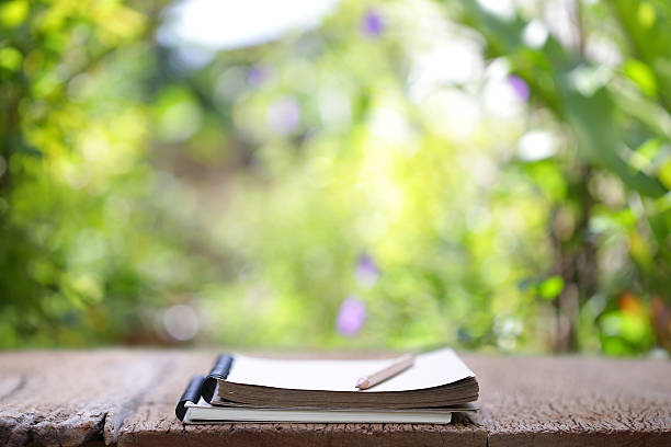 istock Notebook and pencil on wooden table 625220742