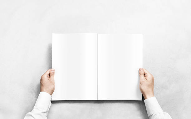 Hand opening white journal with blank pages mockup. Hand opening white journal with blank pages mockup. Arm in shirt holding clear magazine template mock up. spreading photos stock pictures, royalty-free photos & images