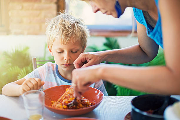 istock Family enjoying delicious pasta meal 625230228