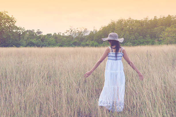 istock Young girl walk in autumn natural grass 625230320