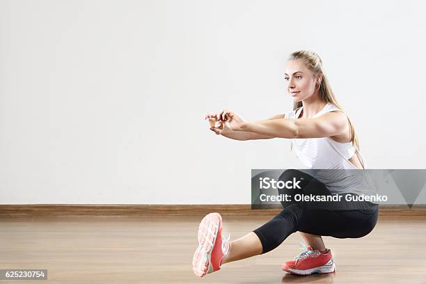Young Fit Woman Works Out In The Fitness Class Stock Photo - Download Image Now - Activity, Adult, Backgrounds