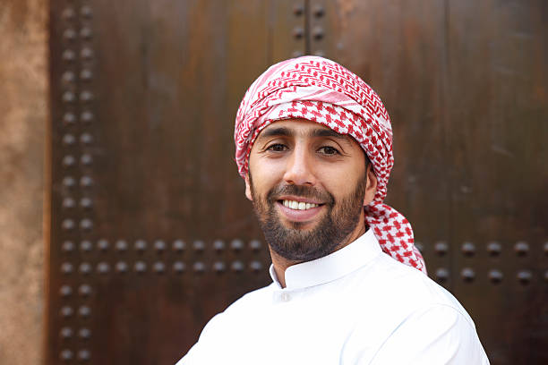 Young arabian man Young smiling handsome arabian man wearing traditional clothes kaffiyeh stock pictures, royalty-free photos & images