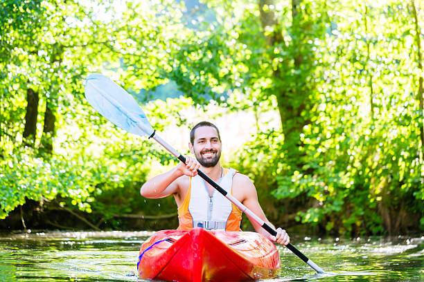 istock Man paddling with kayak on river for water sport 625231064