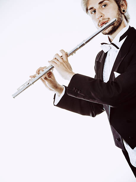 istock Male flutist wearing tailcoat plays flute 625232598