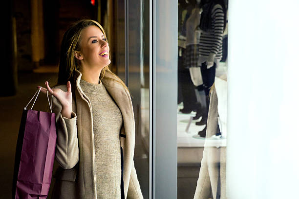 istock Window shopping, woman looking at the store 625232884