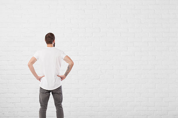 Free Stock Photo of Man Standing in Front of White Brick Wall ...