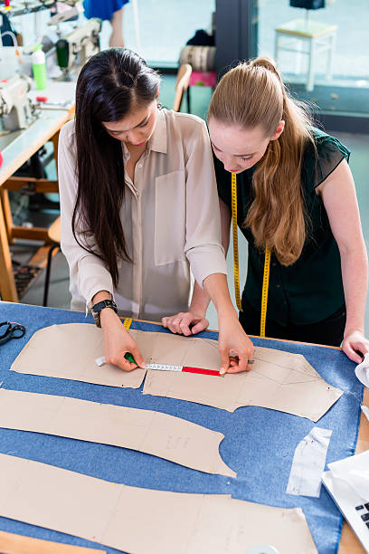 istock Young fashion designers talking about layout 625235606