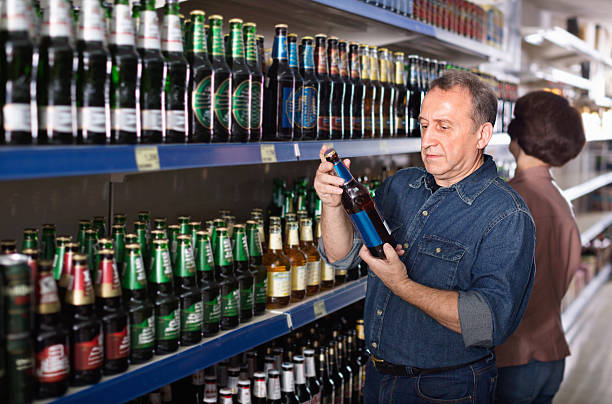 istock Pensioner selecting a beer at the  store 625236780