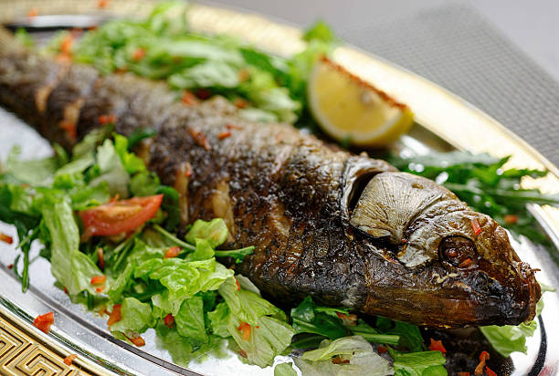 istock Fish food with vegetables and lemon 625236828