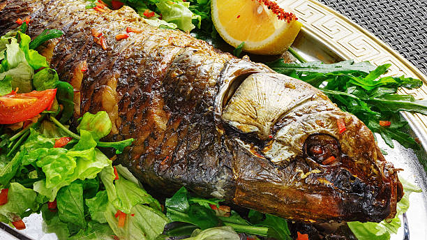 istock Fish food with vegetables and lemon 625236880
