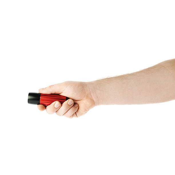 istock Hand holding a flashlight torch, composition isolated over the white 625238360