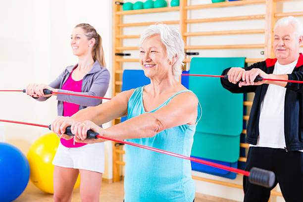 istock Group at fitness training with gymnastic bar 625238612