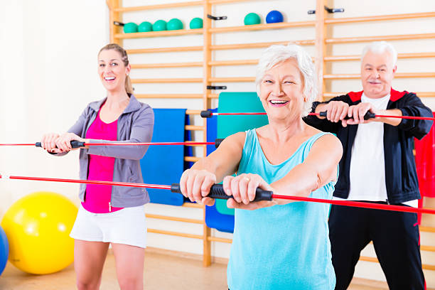 istock Group at fitness training with gymnastic bar 625238688