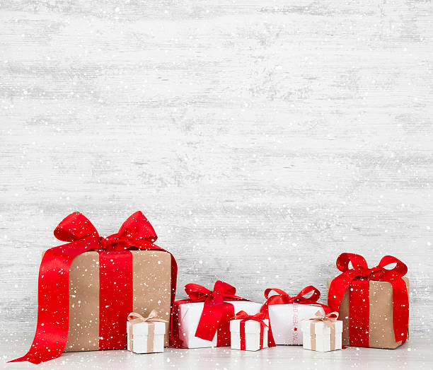 istock Christmas Gift Boxes on White Wooden Background 625238946
