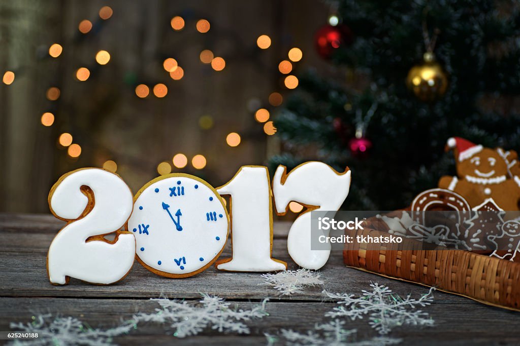 Christmas homemade gingerbread cookies on table, new year 2017 Christmas card with gingerbread men, background boke 2017 Stock Photo