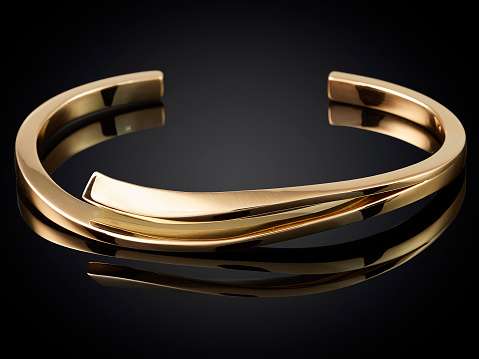 golden bracelet isolated on black background