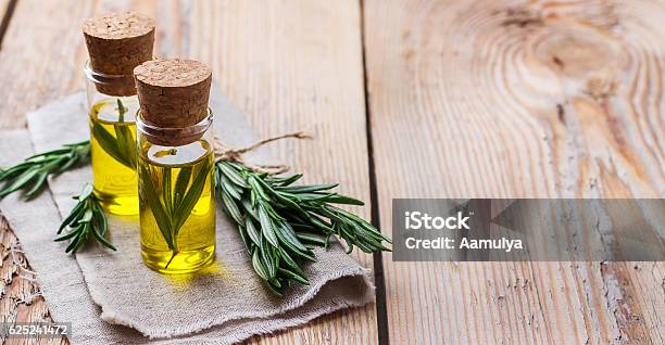 Natural Rosemary Essential Oil For Beauty And Spa Stock Photo - Download Image Now - Essential Oil, Rosemary, Aromatherapy