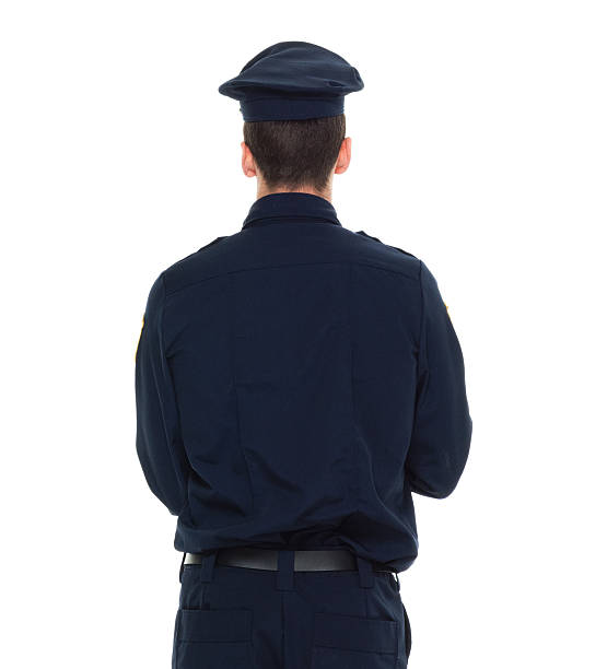 istock Rear view of police standing 625241908